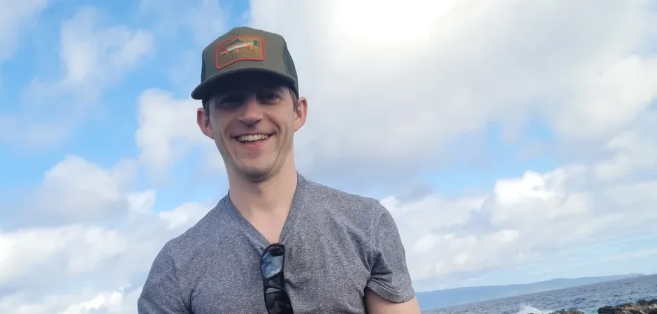 Thomas Hepner smiling on the coast of Hawaii
